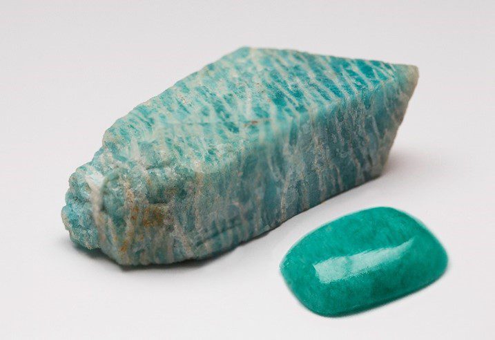 Buying Guide: Get to Know the Feldspar Family of Gemstones - - Amazonite rough and cabochon from the Gem