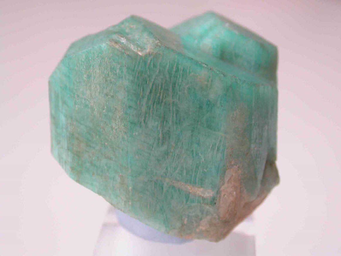 Buying Guide: Get to Know the Feldspar Family of Gemstones - - Rough amazonite crystal photographed