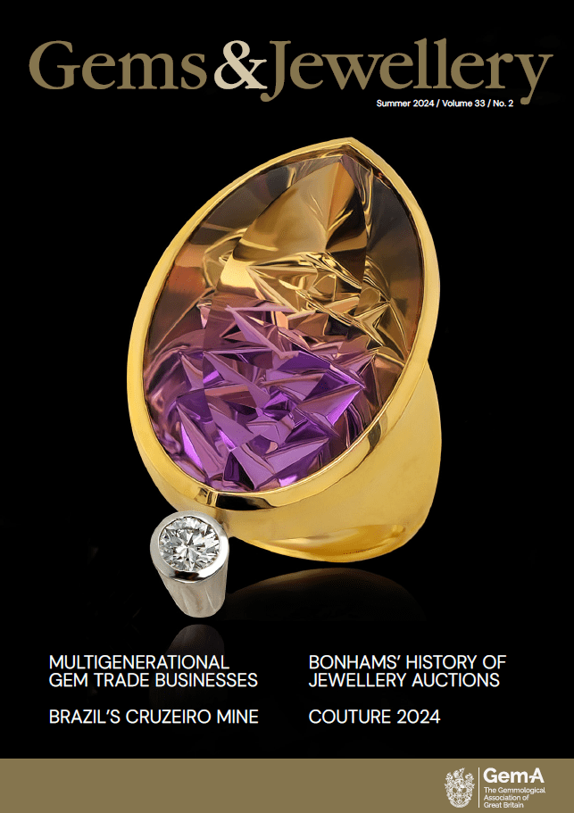 Ametrine ring has been faceted with Dragon Egg cut; it is alongside a 0.15 ct round-brilliant diamond and set in 18K yellow gold.